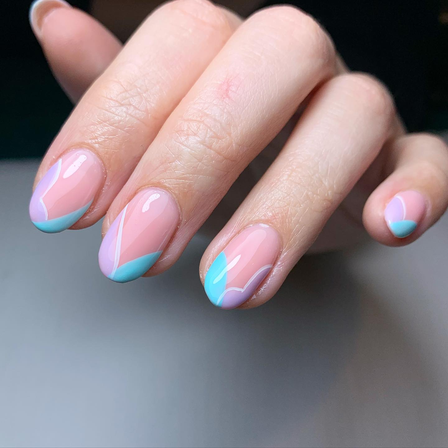 Multicolored pastel manicure with a design of natural flowers on female  hand close up.Summer nail design. Stock Photo | Adobe Stock