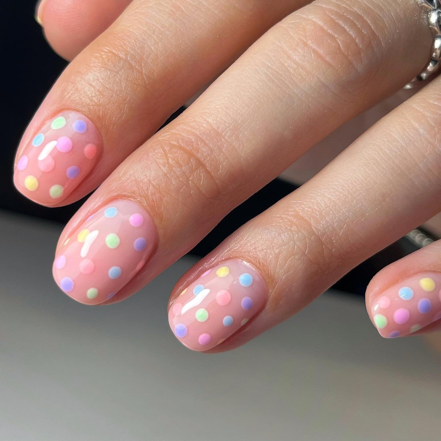 Spring colorful pastel manicure. Fresh Nature trendy nails. Woman hold nail  polish bottle. Fashion Beauty hands. Stylish Nail polish. Stock Photo |  Adobe Stock