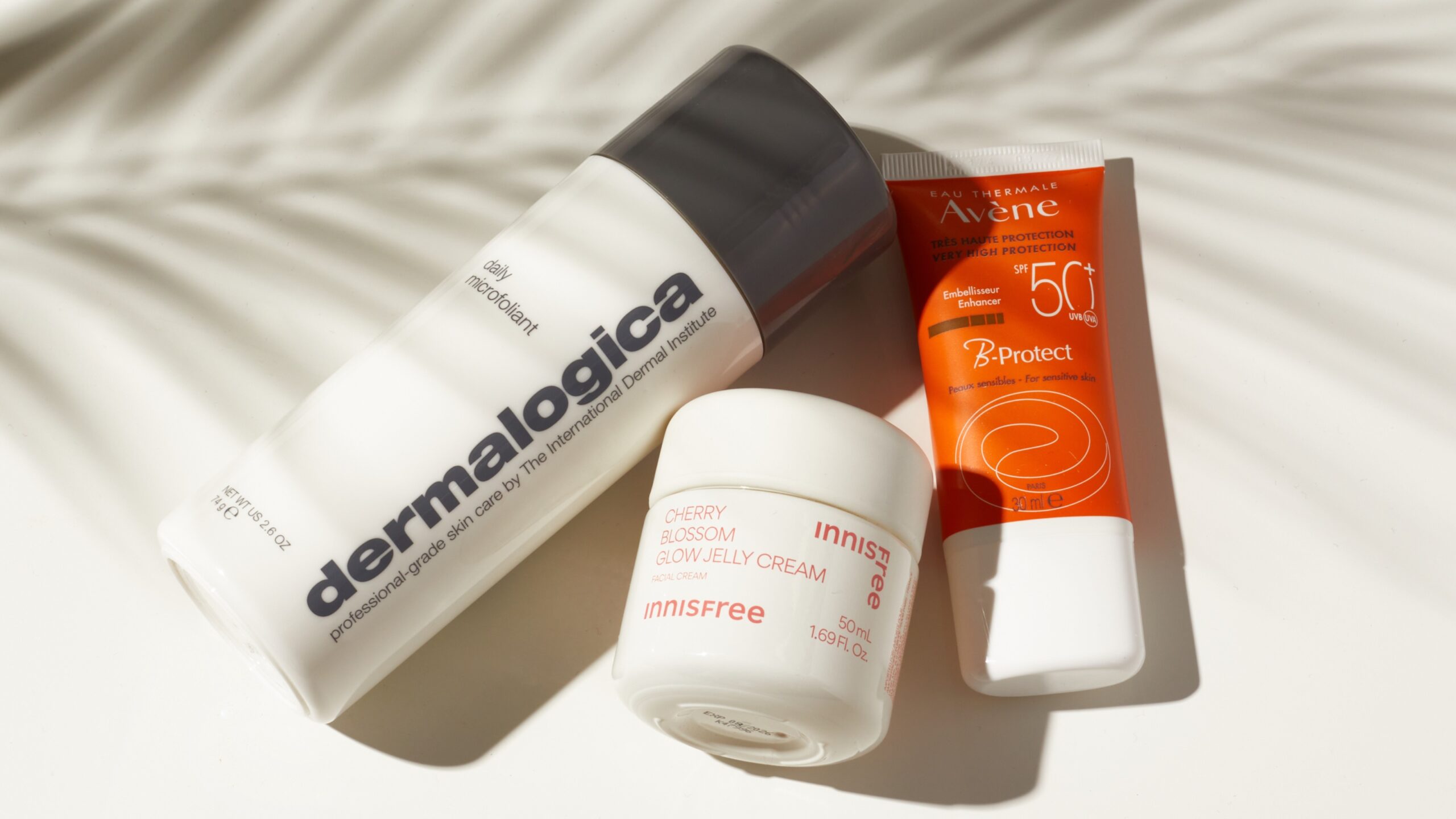 Close up shot of three products perfect to use in your summer skin routine
