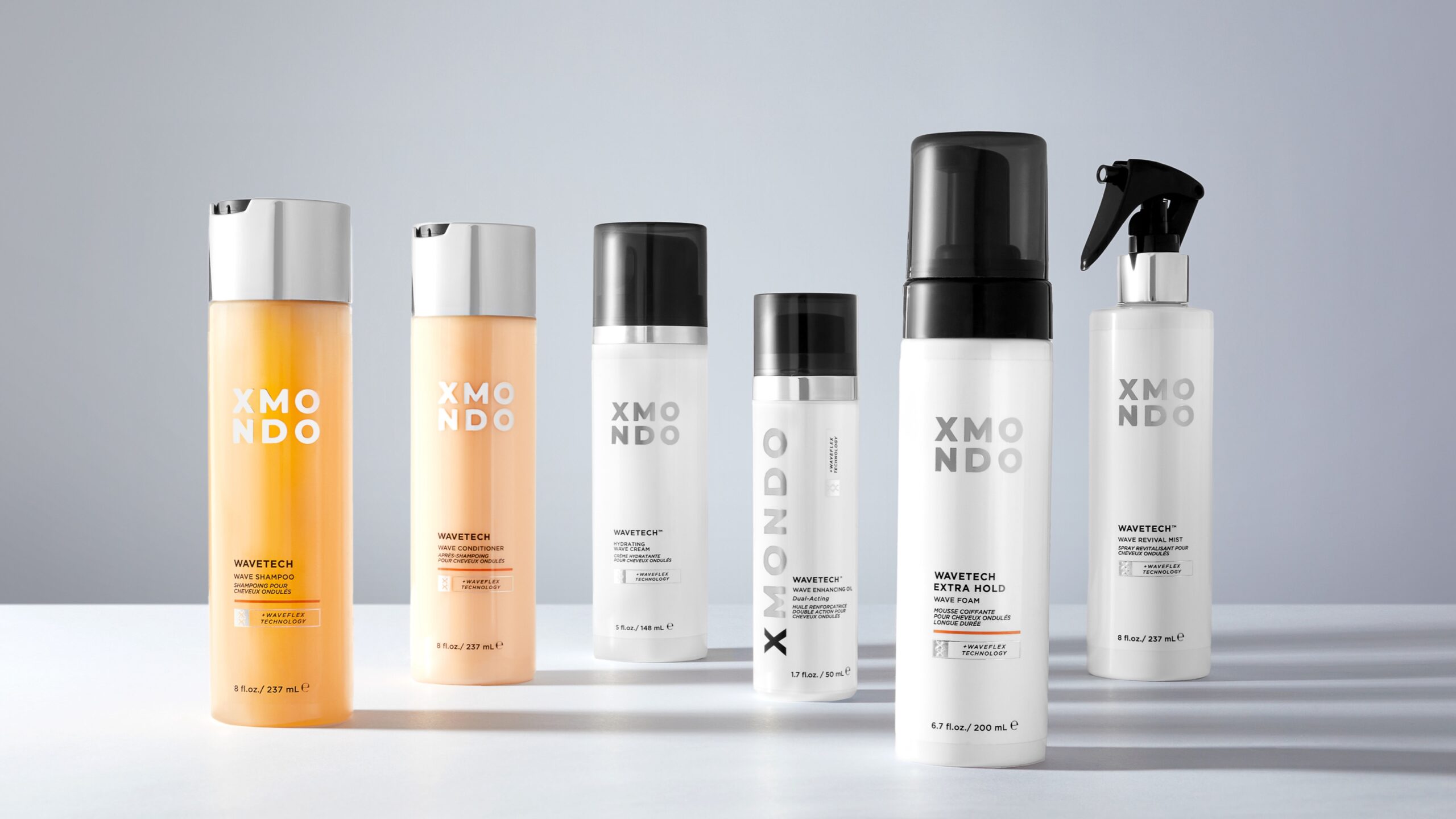 Six haircare products lined up alongside each other