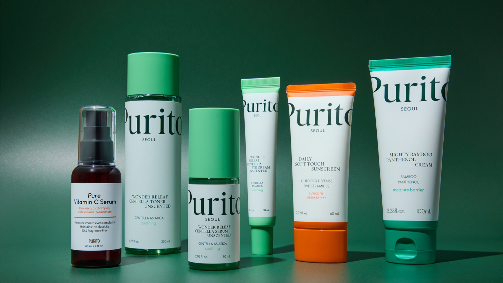 Six Purito Seoul products lined up, in green, white, and orange packaging